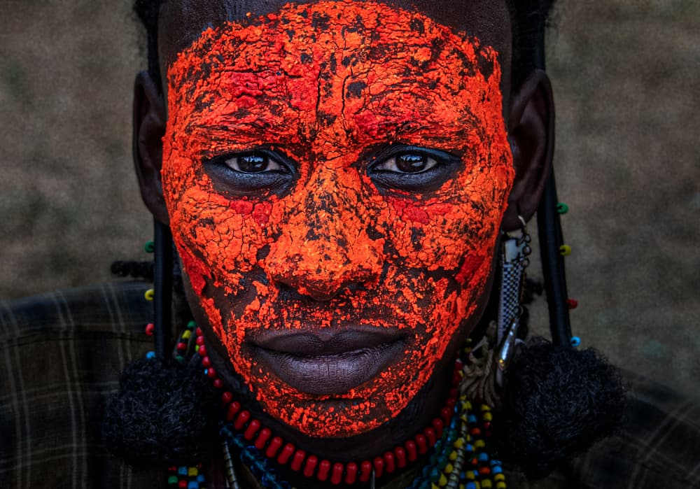 Vibrant Painted Face by Joxe Inazio Kuesta Garmendia — canvas wall art