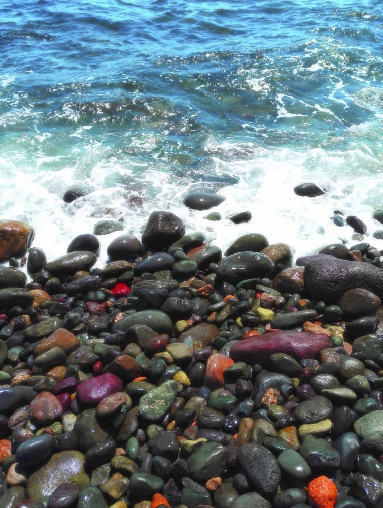 Colorful Pebble Beach by Angelo Cerantola — canvas wall art