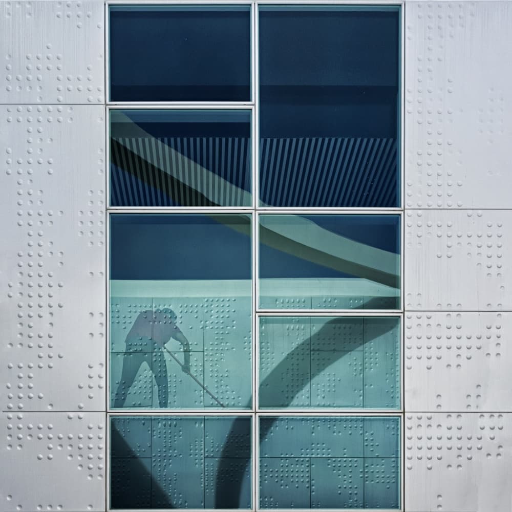 Window Worker Silhouette by Carlos Costa — canvas wall art