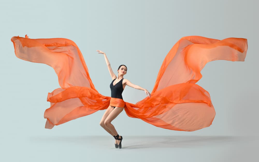 Orange Fabric Dancer by Rawisyah Aditya — canvas wall art