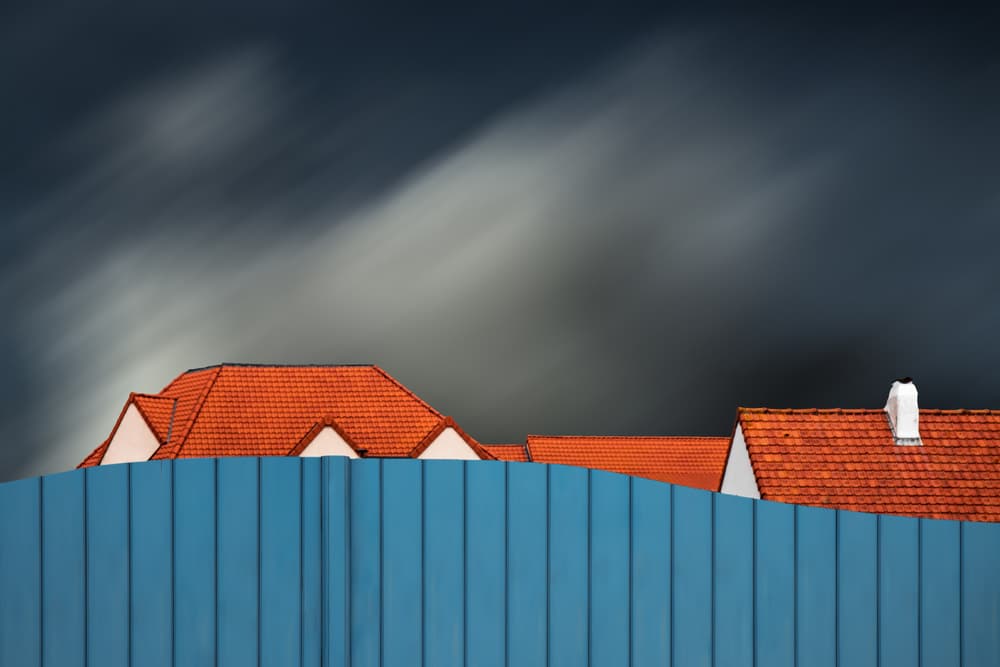 Orange Roofs Dark Sky by Gilbert Claes — canvas wall art
