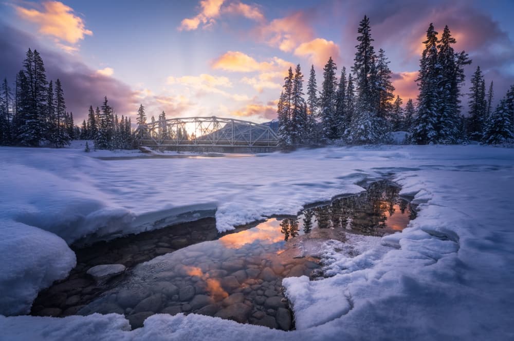 Winter River Bridge Sunset by Yongnan Li (李永男) — canvas wall art