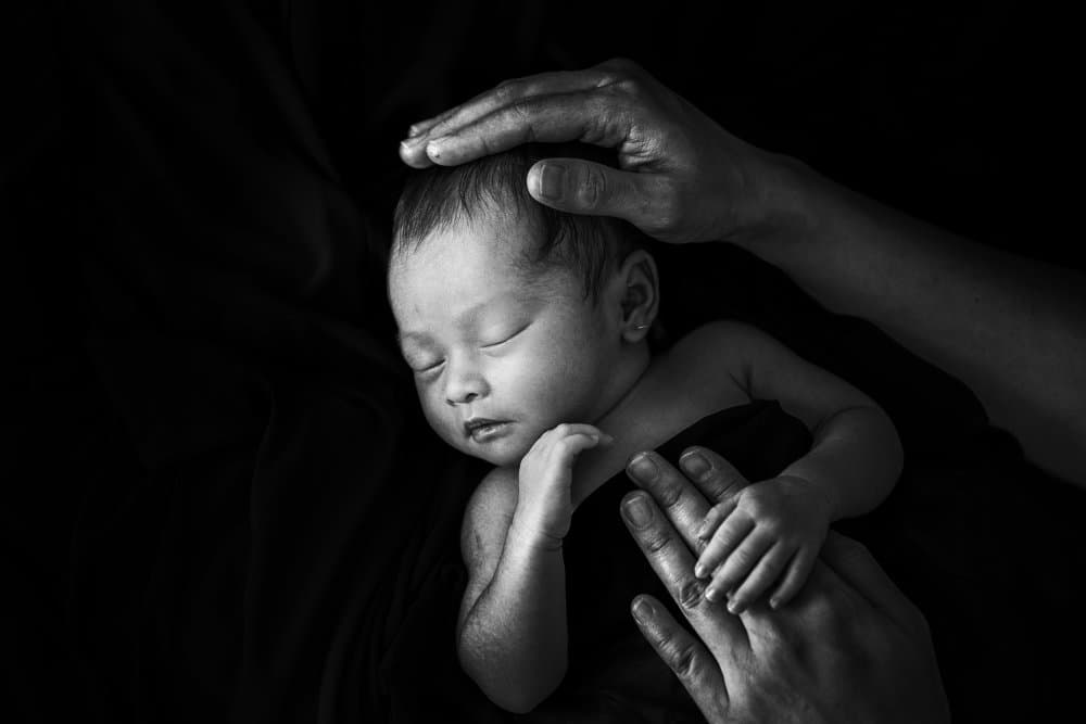 Sleeping Newborn Embrace by Andi Halil — canvas wall art