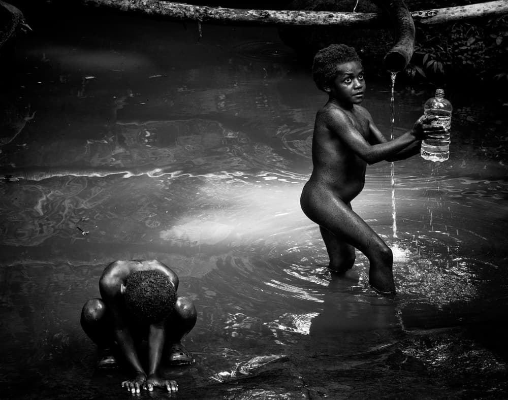 Boys at Water Source by Joxe Inazio Kuesta Garmendia — canvas wall art