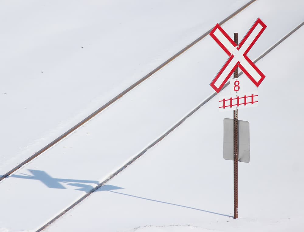 Snowy Railroad Crossing by Jian Wang — canvas wall art