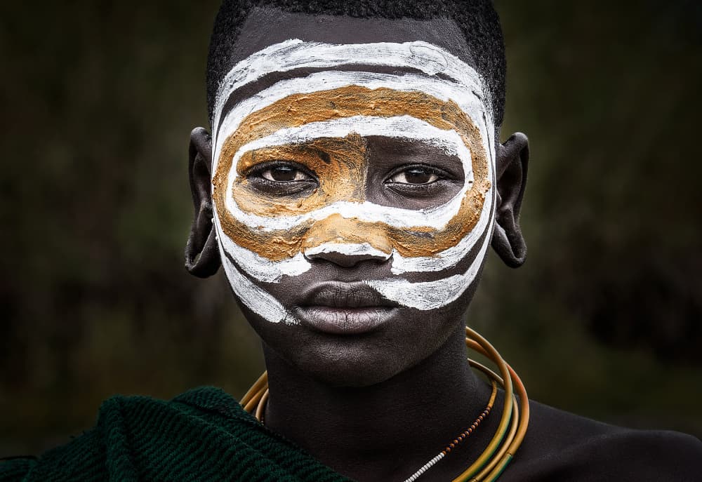 Tribal Painted Face by Joxe Inazio Kuesta Garmendia — canvas wall art