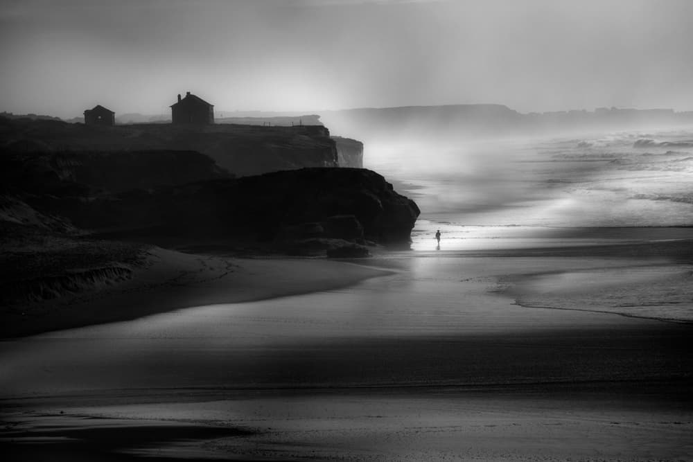 Lone Figure Dark Beach by Olavo Azevedo — canvas wall art