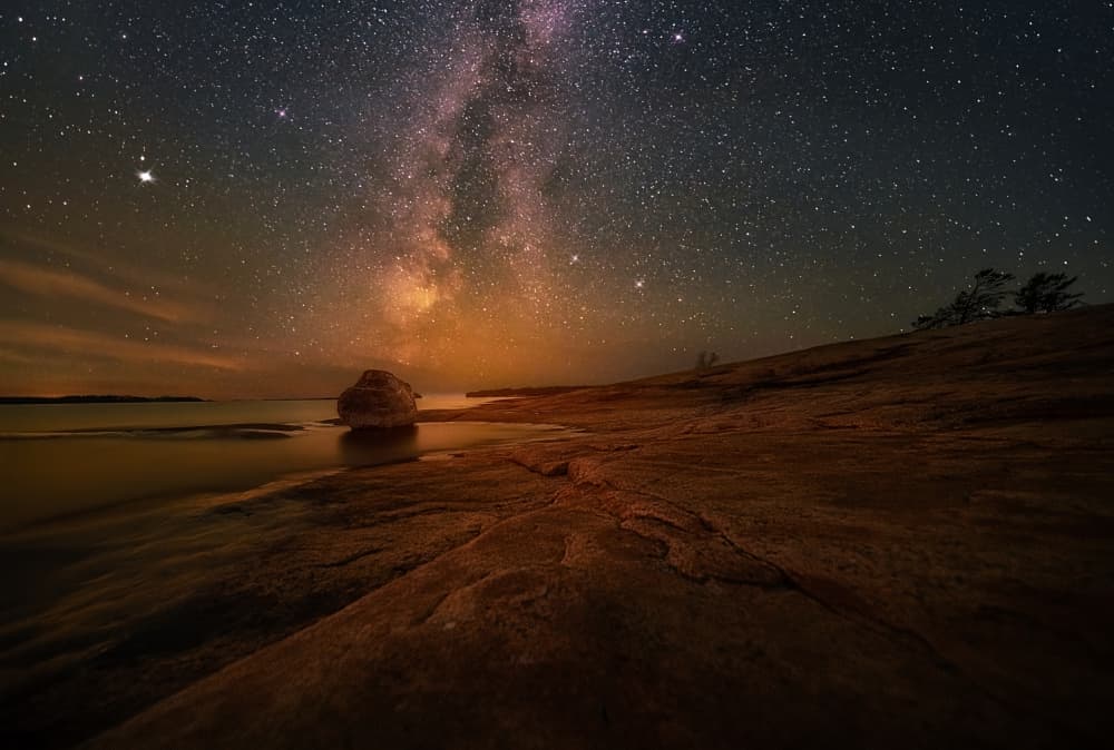 Milky Way Over Rocky Shore by Ben.C.L — canvas wall art