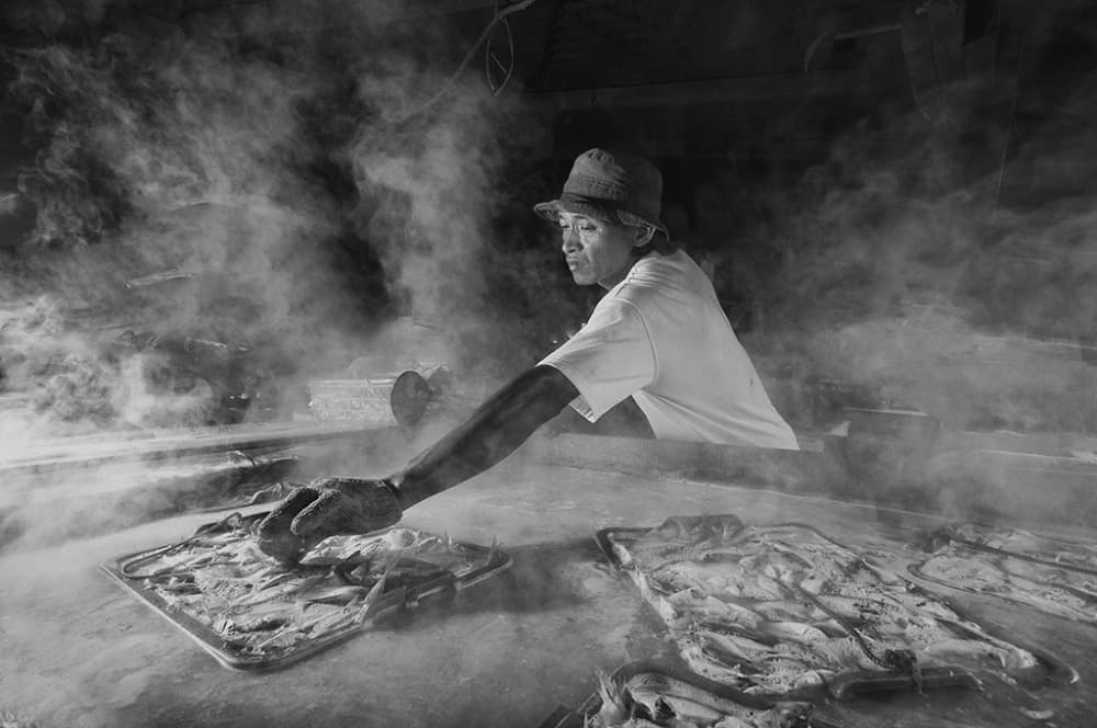 Man Steaming Fish by Antonyus Bunjamin (Abe) — canvas wall art