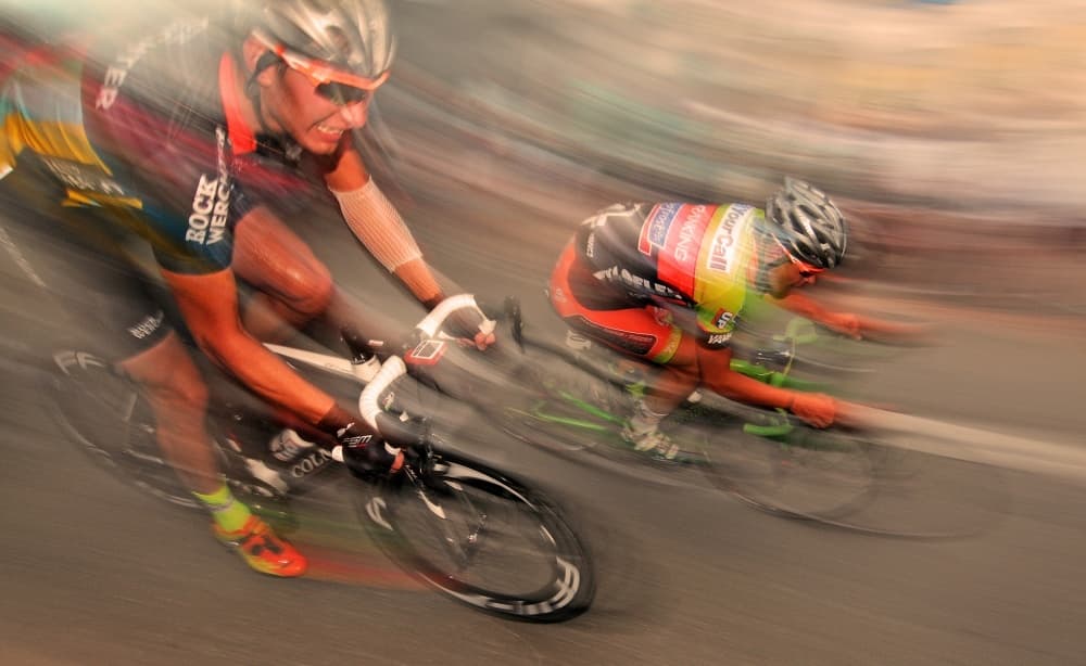 Racing Cyclists Blur by Lou Urlings — canvas wall art