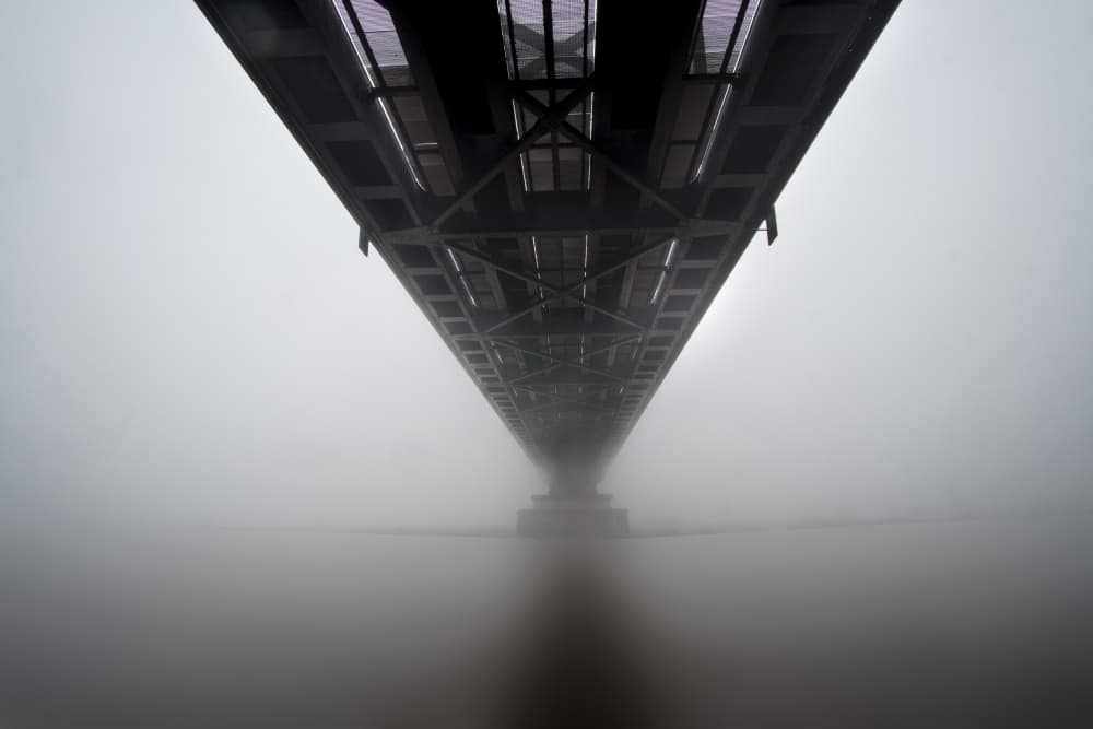 Vanishing Bridge In Fog by Fred Louwen — canvas wall art