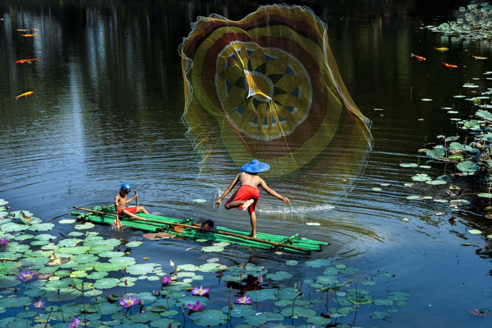 Boys Casting Lotus Pond by Agus Adriana — canvas wall art