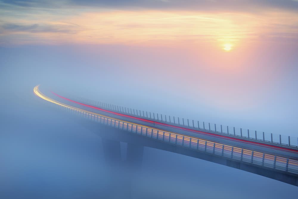 Misty Bridge at Dawn by Ales Komovec — canvas wall art