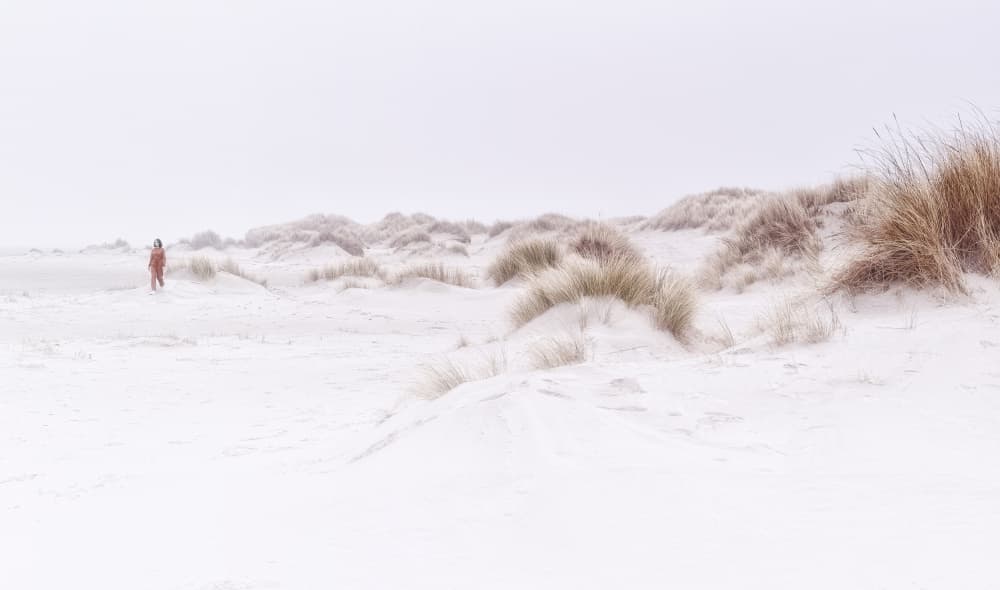 Red Coat Winter Dunes by Stefan Eisele — canvas wall art