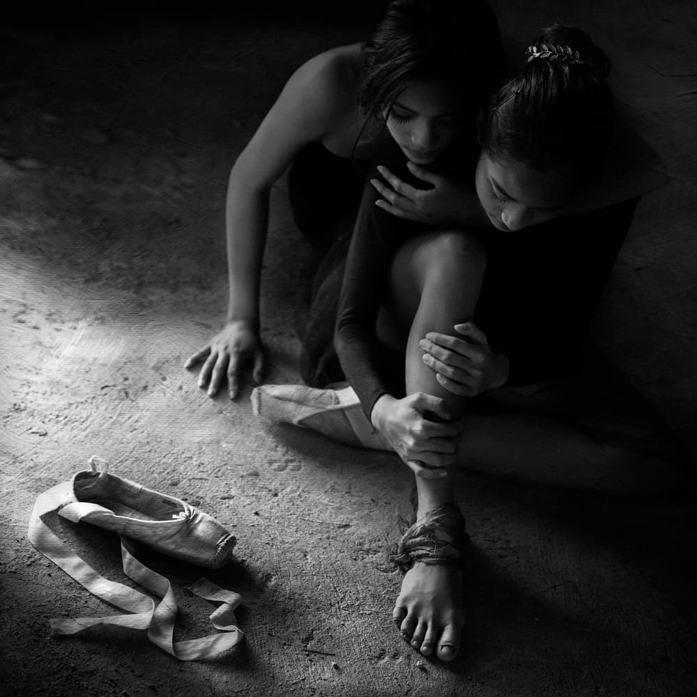 Ballet Dancers' Comforting Embrace by Sebastian Kisworo — canvas wall art