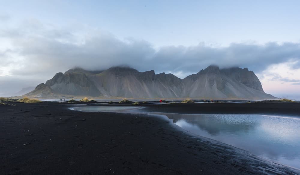 Moody Mountain Beach Reflection by Saskia Dingemans — canvas wall art