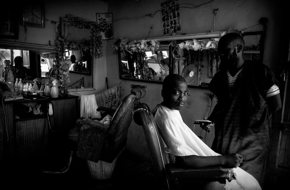 African Barber Shop Portrait by Joxe Inazio Kuesta Garmendia — canvas wall art