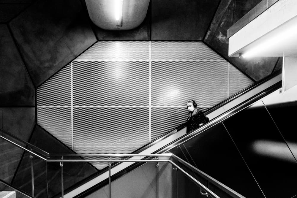 Masked Escalator Ride by Adam Dauria ☂ — canvas wall art