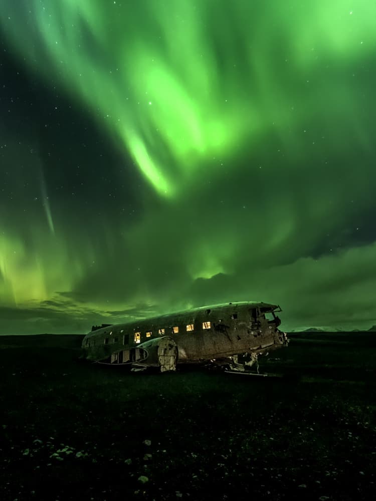 Mysterious Aurora Plane Wreck by Alex Lu — canvas wall art