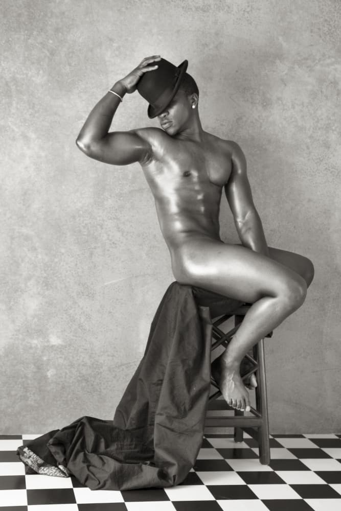 Man on a stool by Mel Brackstone — canvas wall art