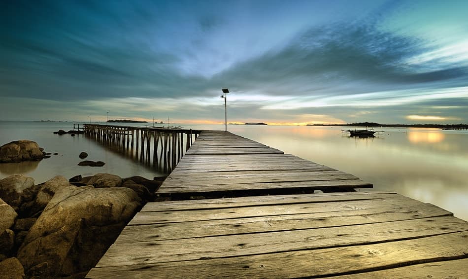 Tranquil Pier Sunset by hardibudi — canvas wall art