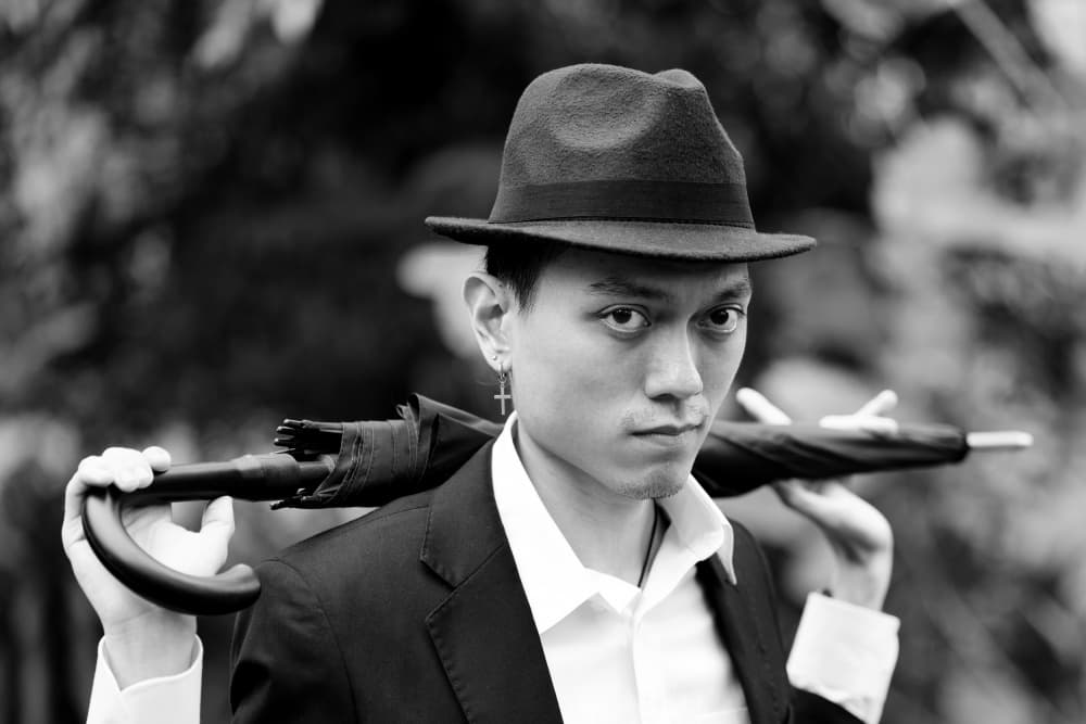 Dapper Man with Umbrella by Kieron Long — canvas wall art