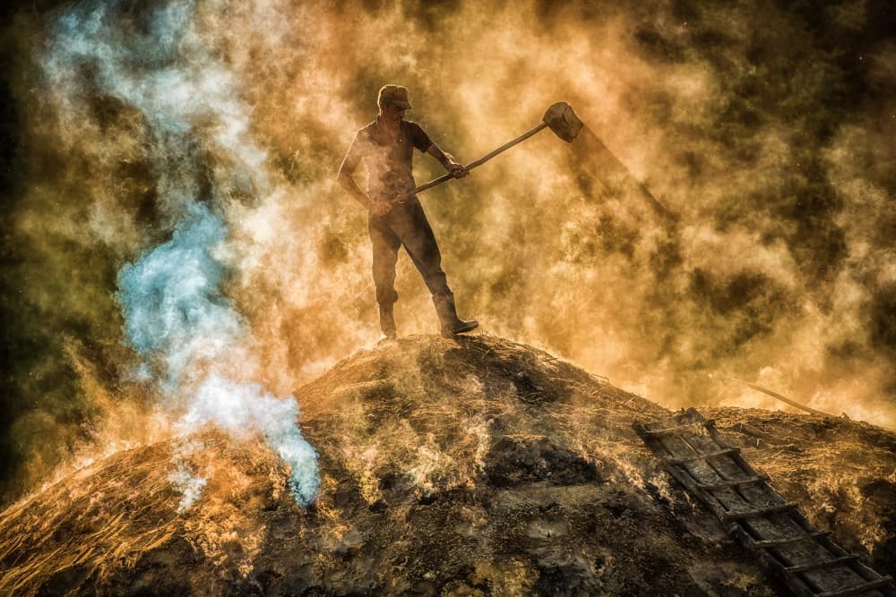 Fiery Charcoal Worker by Adrian Popan — canvas wall art