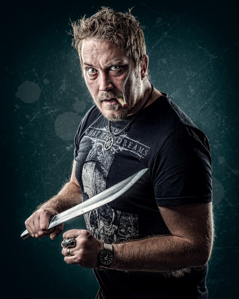 Intense Man with Knife by Petri Damstén — canvas wall art