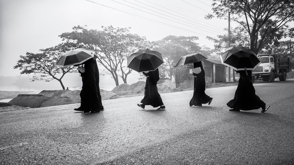 Women Walking Umbrellas by Marcel Rebro — canvas wall art