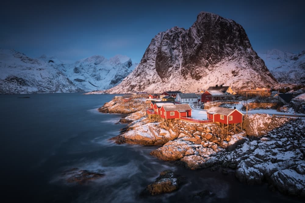 Snowy Norwegian Fishing Village by Raymond Hoffmann — canvas wall art