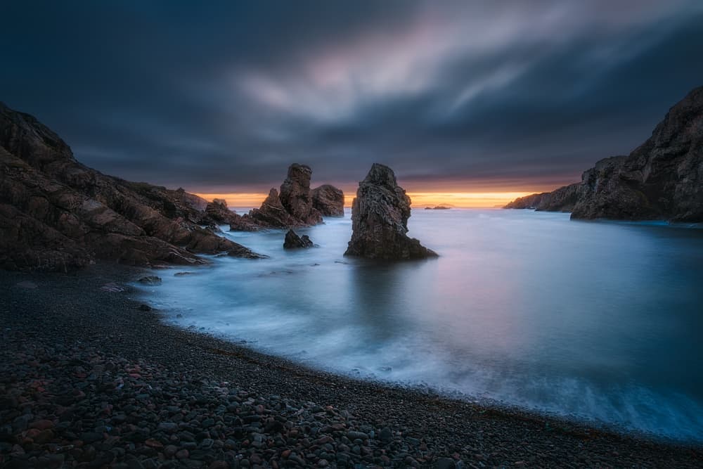 Moody Coastal Rocks at Sunset by Ben.C.L — canvas wall art