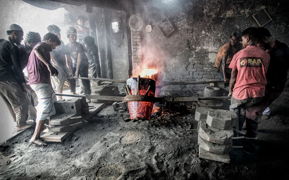 Foundry Workers Casting Metal by Elena Molina — canvas wall art