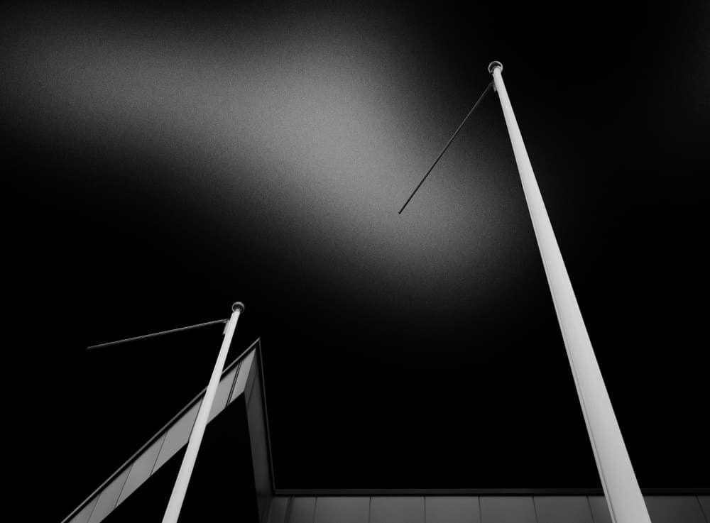 Minimalist Flagpoles Sky by Jeroen van de Wiel — canvas wall art