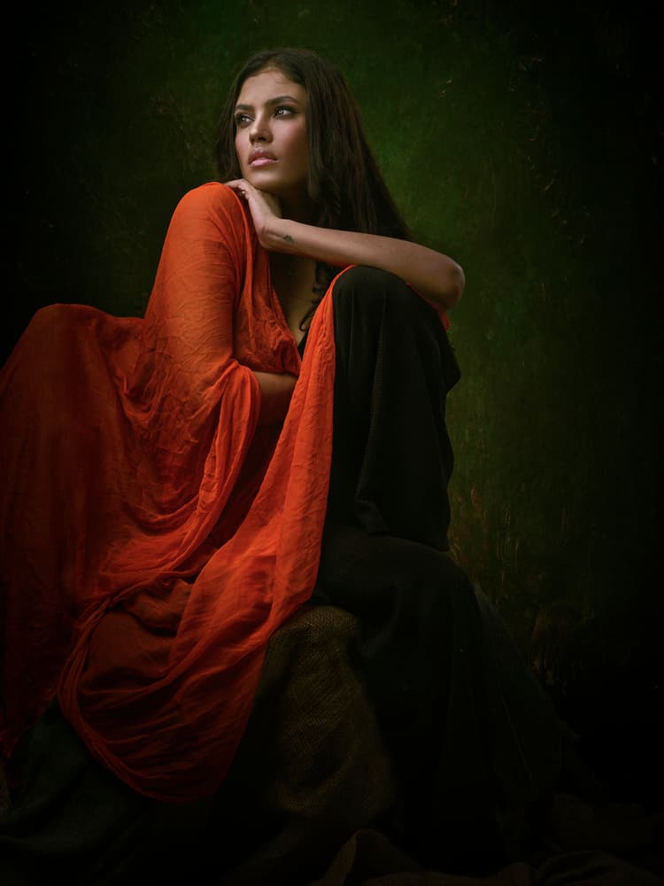 Pensive Woman in Orange by James Mahfuz — canvas wall art