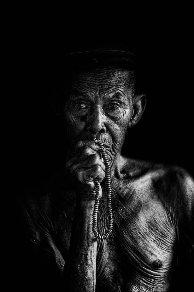 Elderly Man Meditating by Andi Halil — canvas wall art