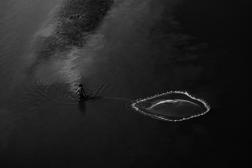 Solitary Fisherman Casting by Kuntal Biswas — canvas wall art
