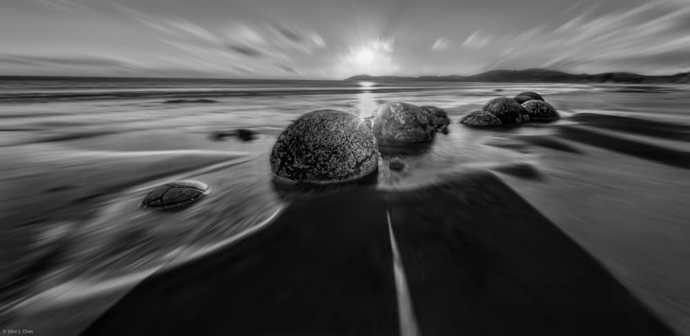 Sunrise Beach Rocks by John J. Chen — canvas wall art