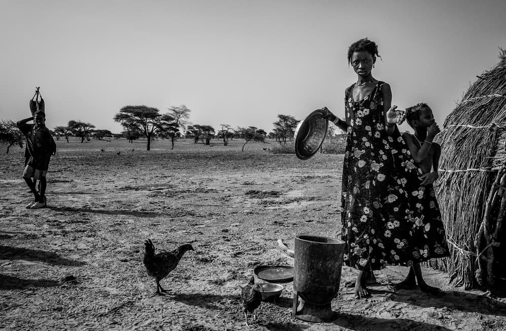 African Village Daily Life by Joxe Inazio Kuesta Garmendia — canvas wall art