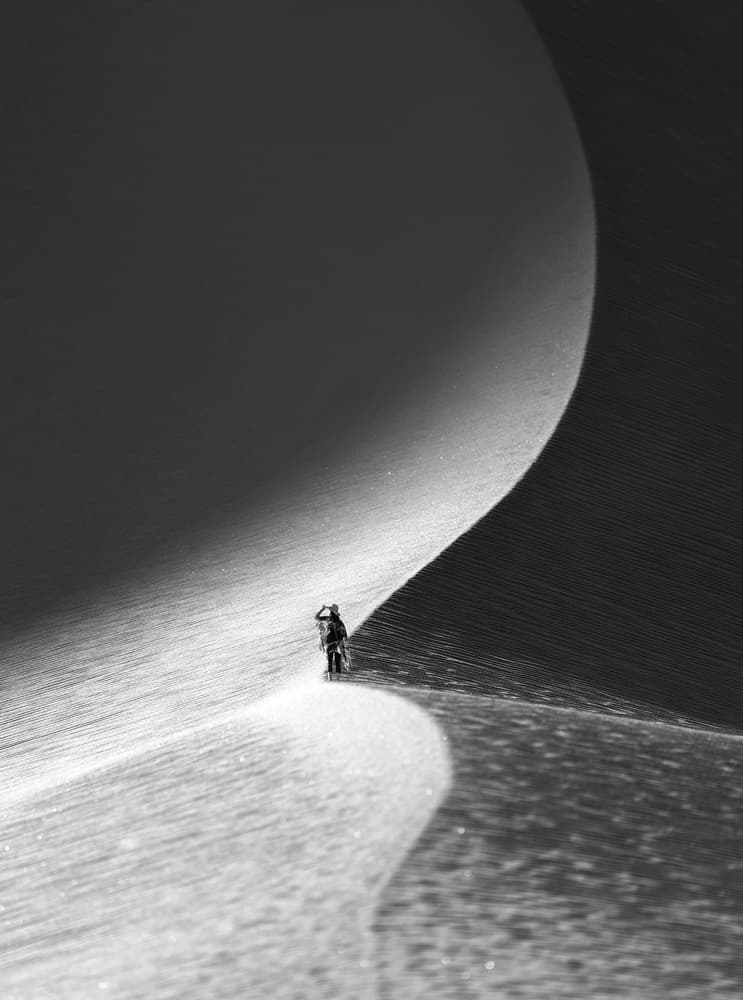 Solitary Dune Ascent by Aidong Ning — canvas wall art