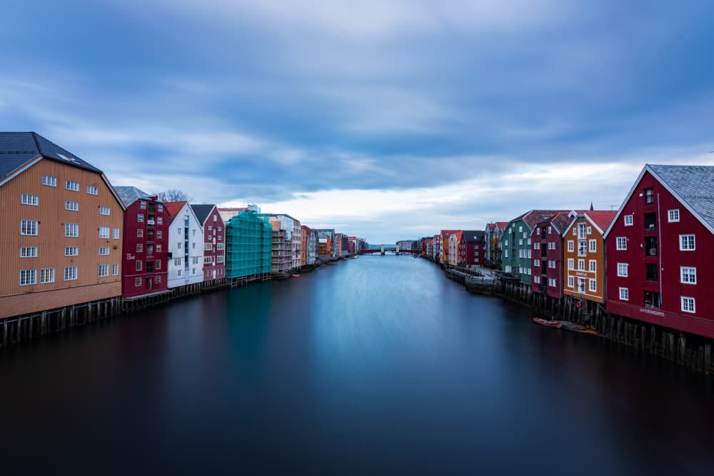 Colorful Trondheim Riverfront by Ashley Sowter — canvas wall art