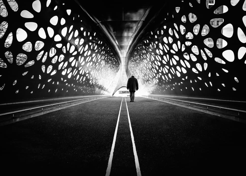Lone Figure Modern Bridge by Christophe Staelens — canvas wall art