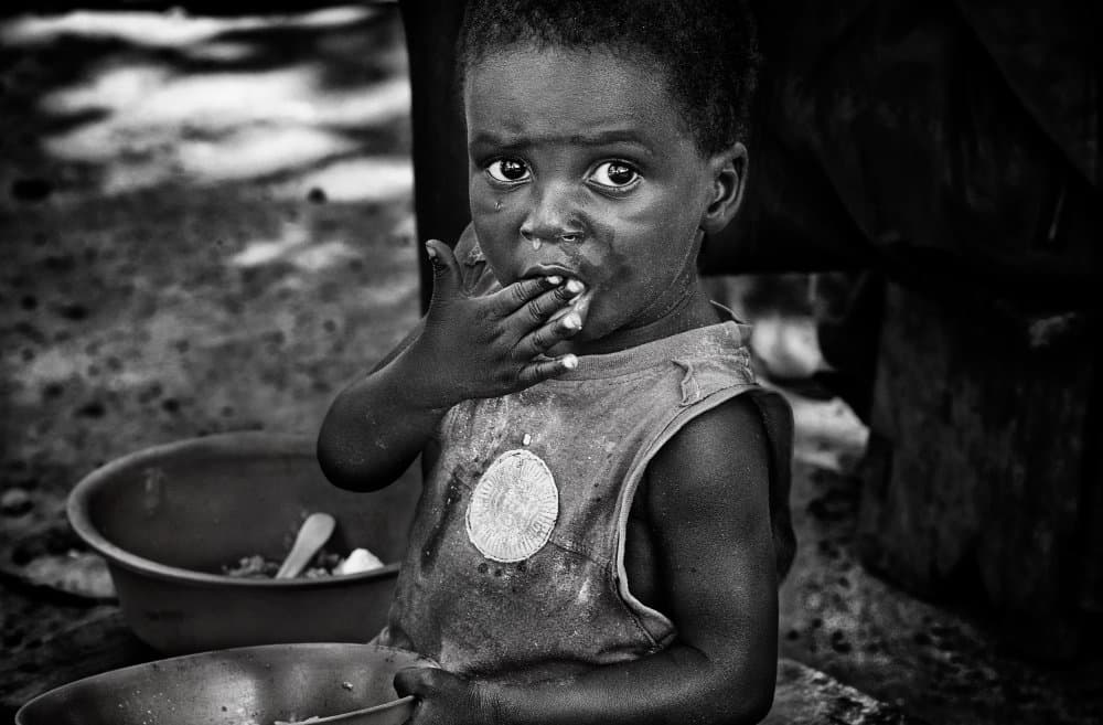 Young Boy Eating by Joxe Inazio Kuesta Garmendia — canvas wall art