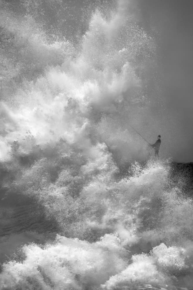 Fisherman Braving Waves by John Fan — canvas wall art