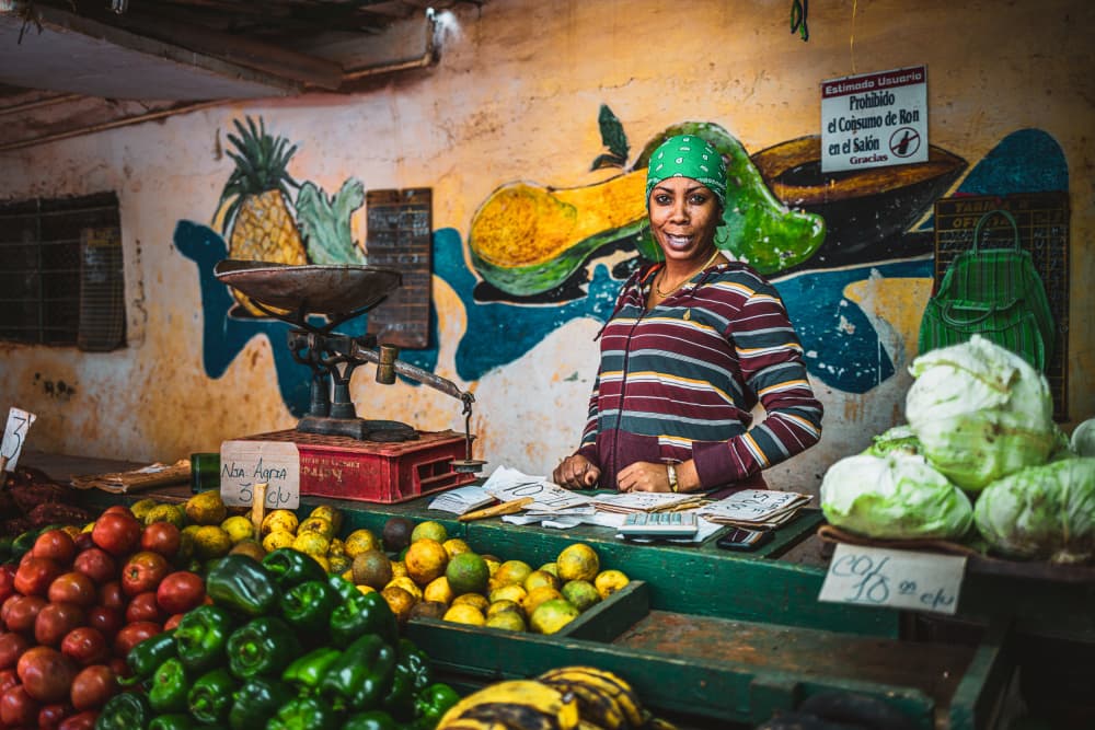 Smiling Cuban Market Vendor by Marco Tagliarino — canvas wall art