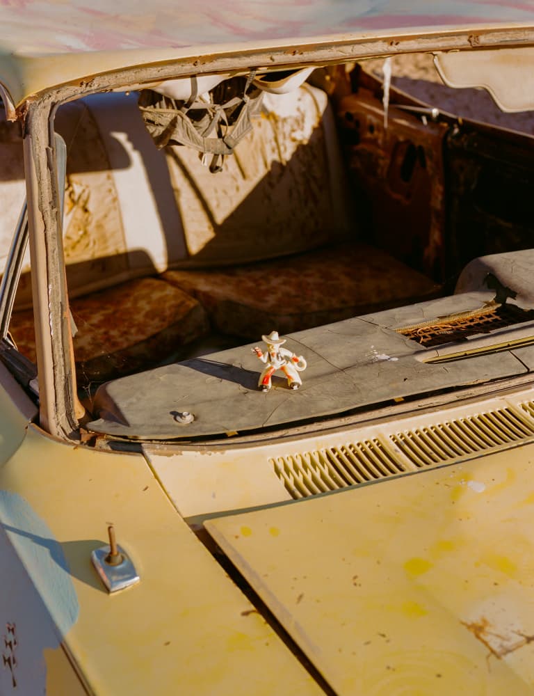 Rusted Car Cowboy Figurine by Bethany Young — canvas wall art