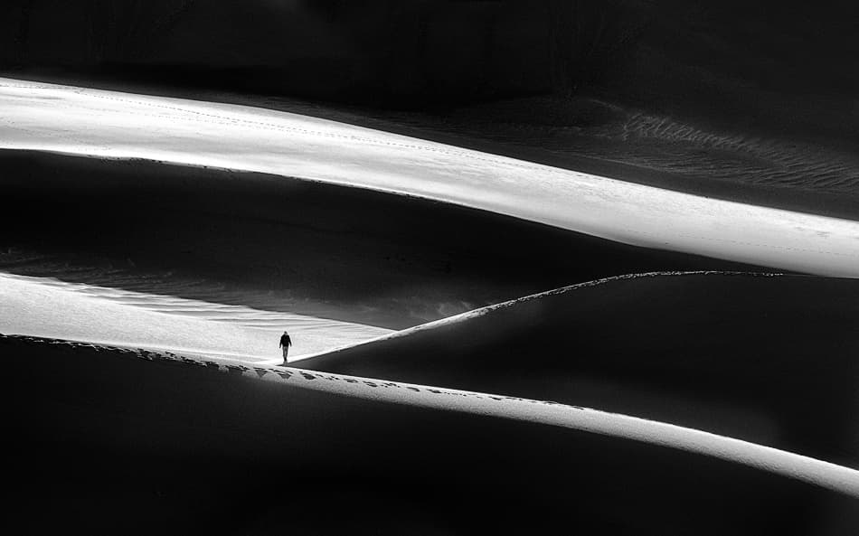 Lone Figure Desert Dunes by Izidor Gasperlin — canvas wall art