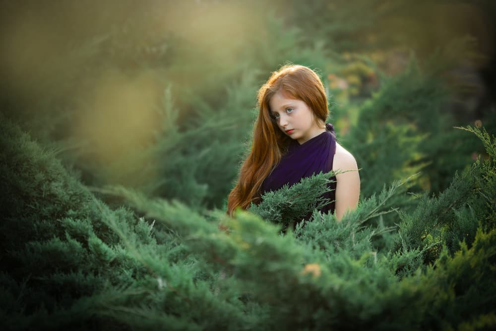 Young Girl Amidst Green by AYMAN KHRBAWE — canvas wall art