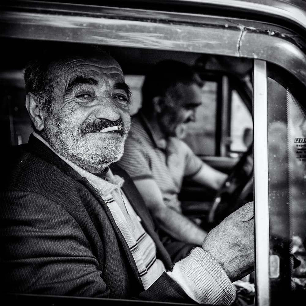 Smiling Man In Car by Marcel Rebro — canvas wall art