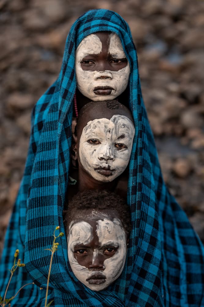 Three Painted Faces by HuongHoang — canvas wall art