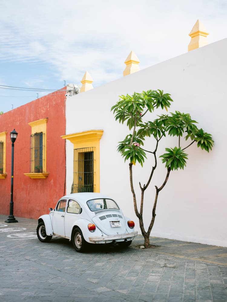 Pastel Volskwagen Beetle in the streets of Oaxaca Mexico by Raisa Zwart — canvas wall art